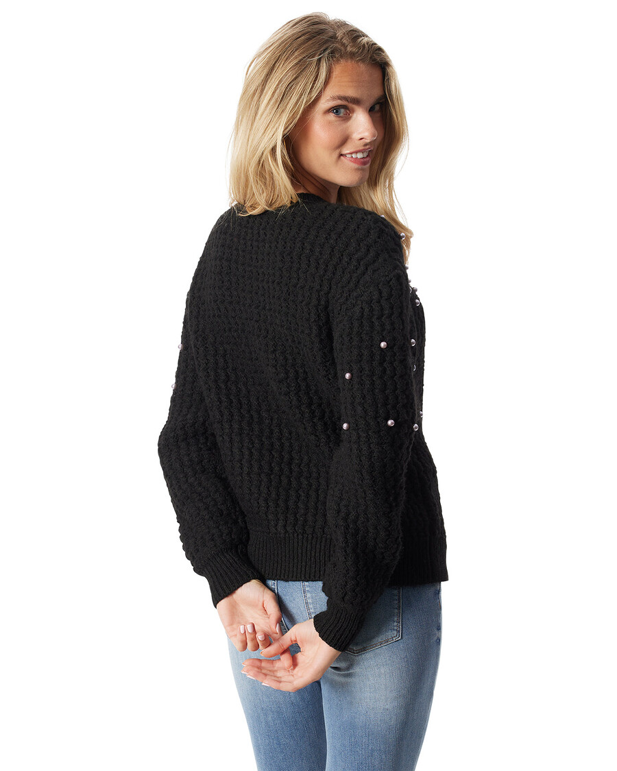 Jessica Simpson καμάρι πουλόβερ σε μαύρο χρώμα